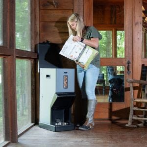 SimplePets BLAZER Automatic Dog Feeder being filled with feed